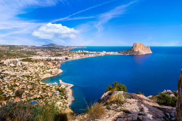 Beautiful super wide-angle aerial view of Calpe, Calp, Spain with harbor and skyline, Penon de Ifach mountain, beach and scenery beyond the city