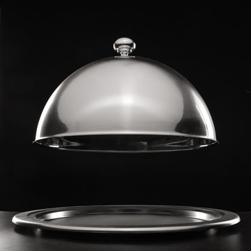 Tray and cloche on dark background