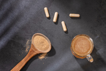 Lepidium meyenii - Maca root health drink in a glass with powdered