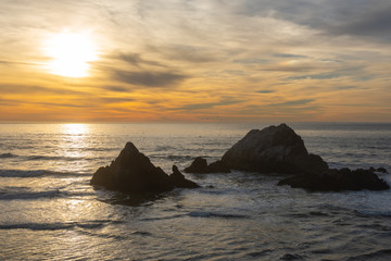 Fototapeta na wymiar Ocean Beach at dusk with the Seal Rock in San Francisco, California