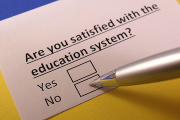 Obraz premium Are you satisfied with the education system? Yes or no?