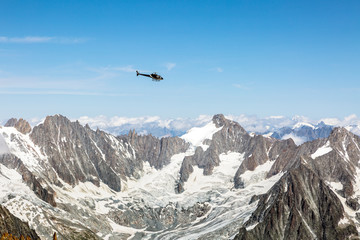 Helicopter over Aiguille du midi in the French Alps, Chamonix-Mont-Blanc, France