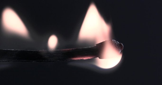 Match lighting and burning till the end and finally disappears from the flame on black background	