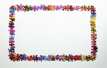 frame made of colorful puzzle pieces