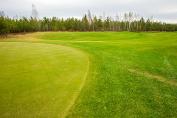 Player a during a golf game during a hit