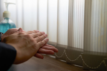 Obraz premium hands washing alcohol gel after back home from work with copy space