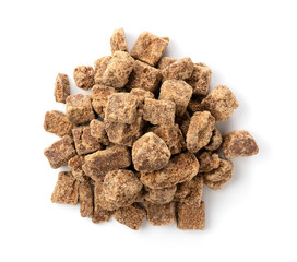 A bird's-eye view of a block of brown sugar placed on a white background