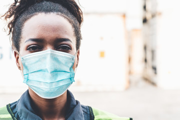 Factory workers with face mask protect from outbreak of Coronavirus Disease 2019 or COVID-19. Concept of protective action and quarantine to stop spreading of Coronavirus Disease 2019 or COVID-19.