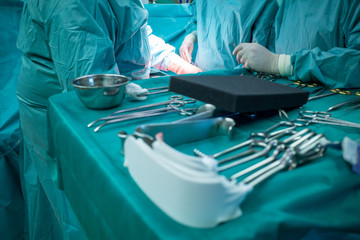 some sterile surgical instruments are on a table during an operation