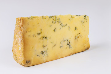 Chunk of Roquefort cheese on white background.