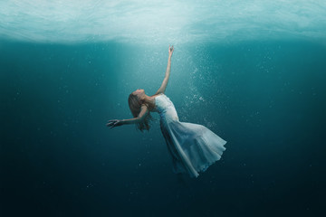Dancer underwater in a state of peaceful levitation - 346708198