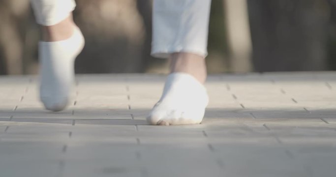 Dancer Feet Dancing Outdoors In Detail Shot With Torn Socks