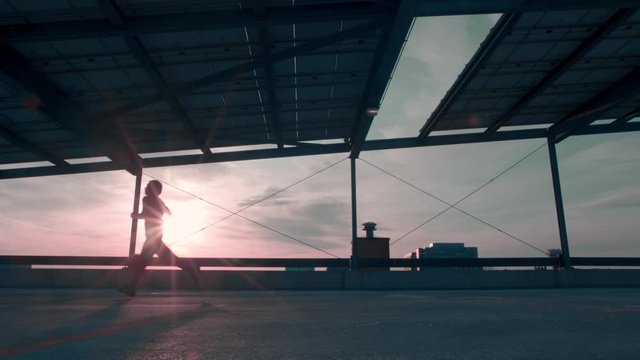Athletic Man Running at Sunset