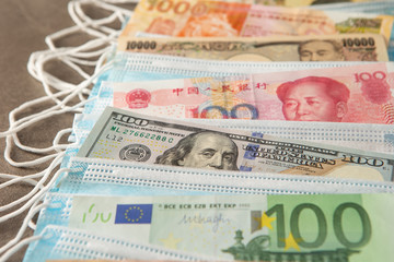 World currency with face mask