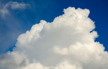 White clouds against a blue sky.