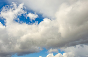 White clouds against a blue sky.