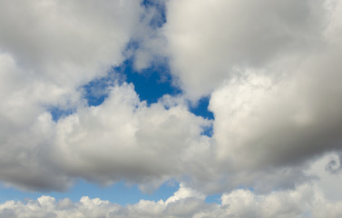 White clouds against a blue sky.