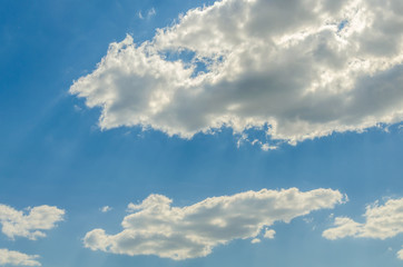 White clouds against a blue sky.