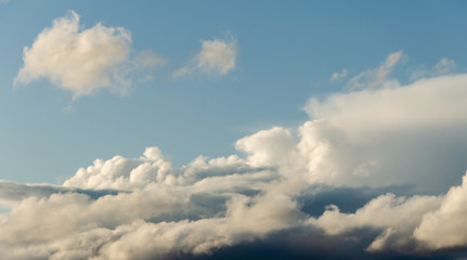 White clouds against a blue sky.