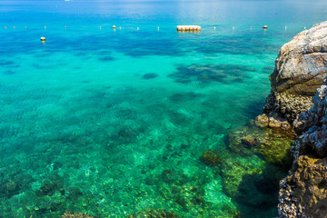 Tropical island rock on the beach with blue sky. Koh kham pattaya thailand.
