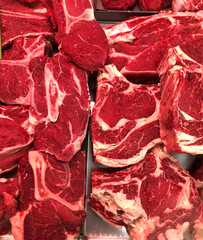 a lot of veal meat on supermarket shelves