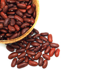 Red kidney beans in a coconut shell bowl isolated on a white background. High protein. Top view with copy space. Close up..
