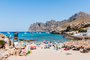 Fototapeta na wymiar Beach, sea and mountain landscape in Cala San Vicente, Majorca