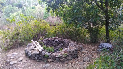Obraz premium old stone fence on the top of a well
