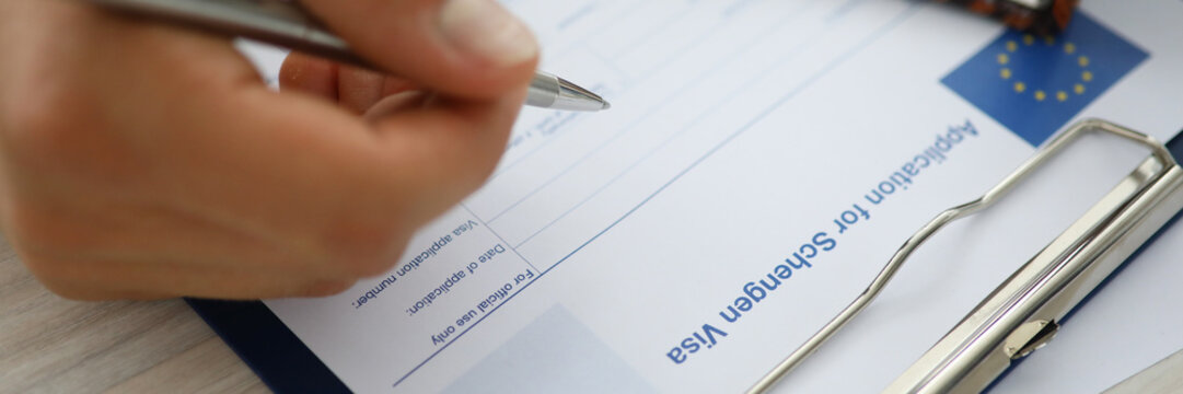 Man writing down personal information