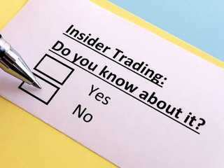 Obraz premium One person is answering question about insider trading.