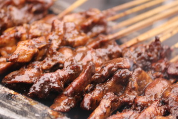 Satay (Indonesian: Sate) is a Indonesian dish of seasoned, skewered and grilled meat, served with a sauce.
