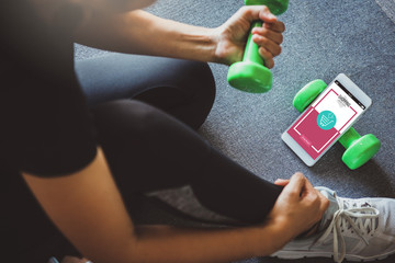 Online shopping and modern lifestyle concept: young woman shopping online  while resting after workout in fitness home.