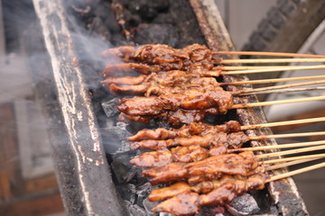 Satay (Indonesian: Sate) is a Indonesian dish of seasoned, skewered and grilled meat, served with a sauce.