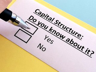 Obraz premium One person is answering question about capital structure.