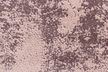 Background from a sample of furniture velor brown and beige in macro. Fabric with villi for sofa upholstery.