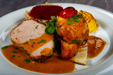 lunch with meat roll with vegetables and sauces and beets