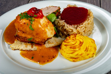 in the plate we find the meat flavor of potatoes and vegetables with cabbage and sauces