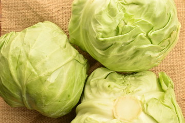 Fresh green cabbage on jute cloth.