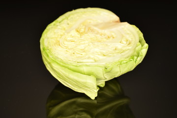 Green cabbage, macro, on a black background