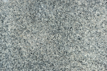 Natural dark polished Granite fine-grained texture , with minimal additional inclusions and large grains. granite stone tile surface
