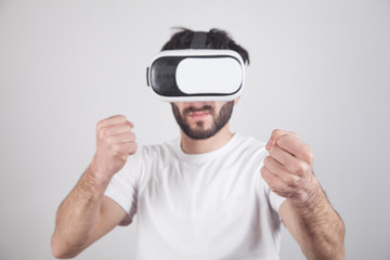 Man wearing VR goggles. Fight in virtual game