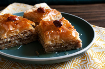 Sweet walnuts dessert, pastry dough, honey, turkish baklava. Home made bakery. Close up.