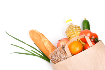 Paper bag with food supplies for the period of quarantine isolation on a white background. Copyspace.