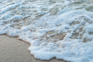Waves and sandy beaches, clear water