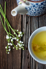 lilies of the valley on wooden background