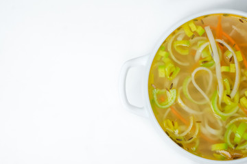 food soup in a white plate on a white background