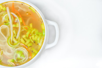 food soup in a white plate on a white background