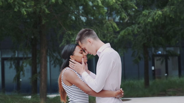 Multiethnic Woman And Man Putting Foreheads Together. Relationship Concept.