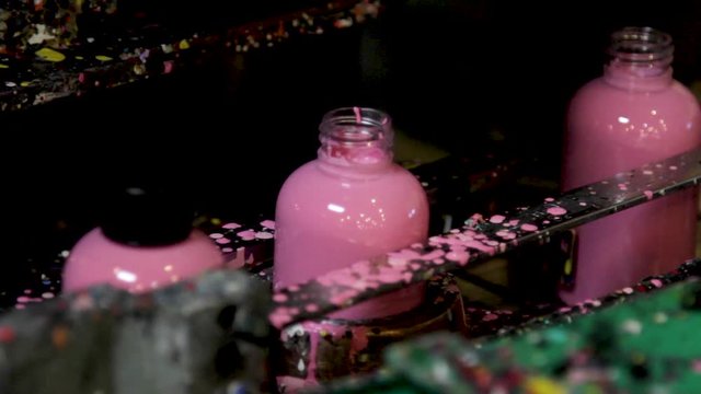 Acrylic Paint Bottle Machine Filling Pink Paint in Factory