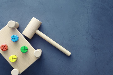 Children's development. Children's wooden toy on the table in the play area. Room of children's creativity and self-development. Wooden constructor.